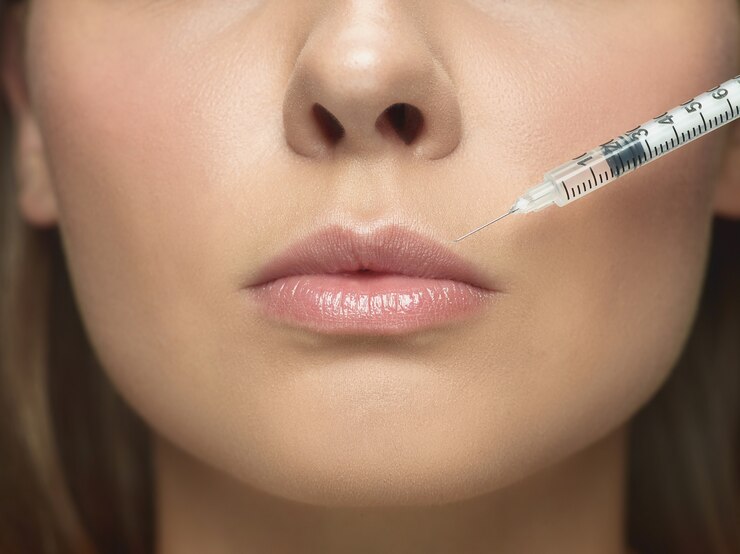 close-up-portrait-young-woman-white-studio-wall-filling-surgery-procedure-lip-augmentation_155003-35059