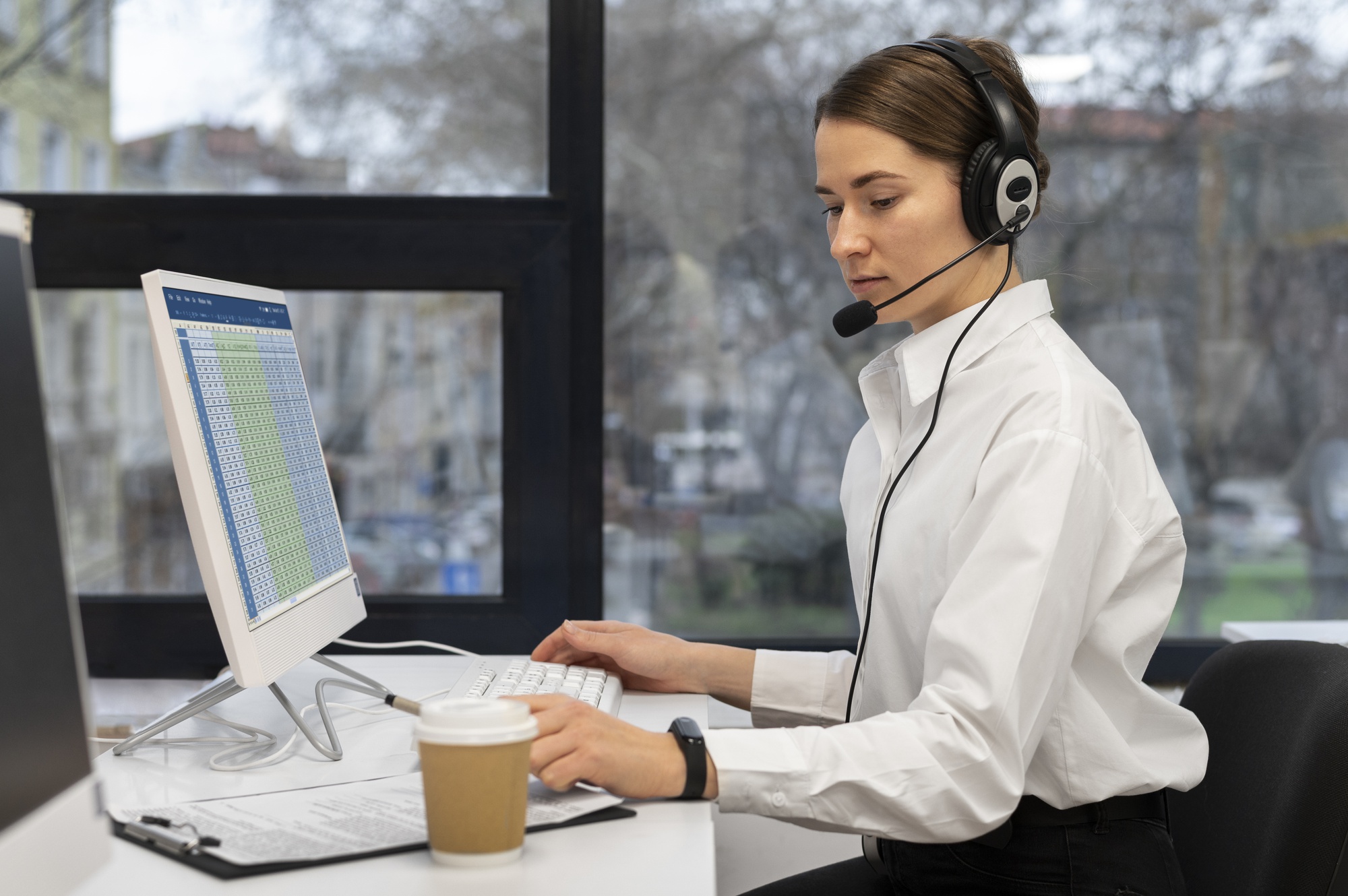 woman-working-call-center-office-with-headphones-computer