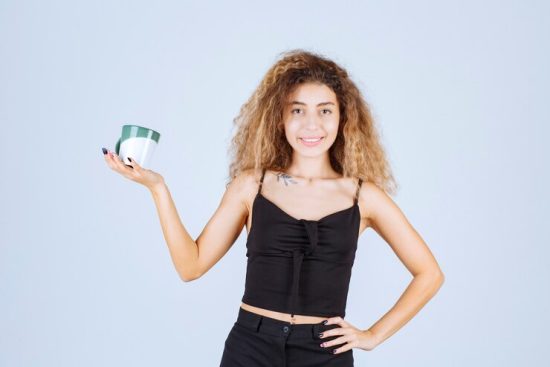 blondie-girl-holding-coffee-cup-as-morning-routine_144627-58456