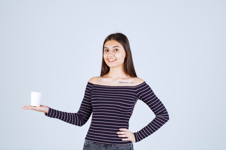 girl-striped-shirt-holding-plastic-coffee-cup-looks-positive_144627-51863