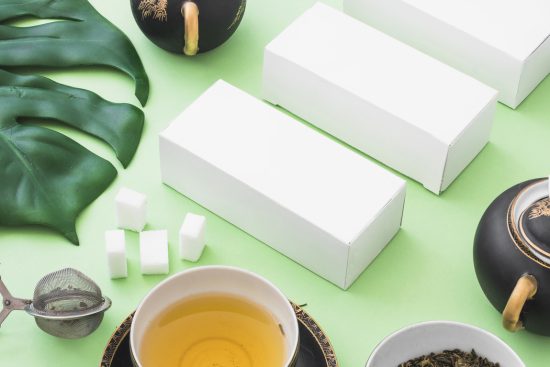 herbal-tea-sugar-cubes-tea-strainer-white-boxes-green-backdrop (1)